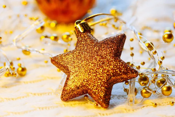 Christmas and New Year decorations star on yellow lights background