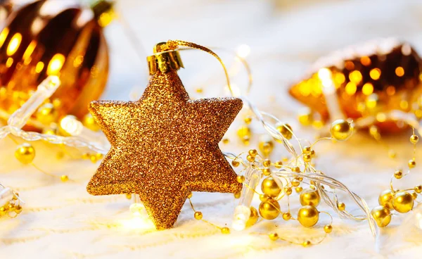 Christmas and New Year decorations star on yellow lights background