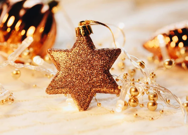 Christmas and New Year decorations star on yellow lights background