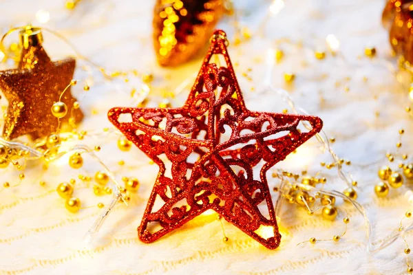 Christmas and New Year decorations star on yellow lights background