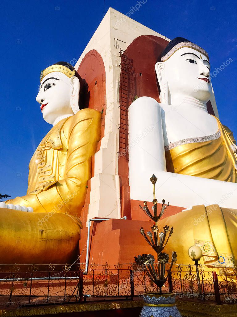 The Kyaik Pun Pagoda consists of four giant statues of Buddha, surrounded by Planetary posts, small shrines and image houses, Bago, Myanmar