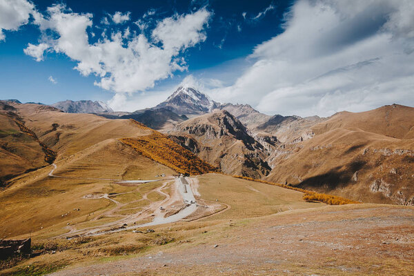 Caucasian mountains. A view of snow-covered summit of Mount Kazbegi, Georgia