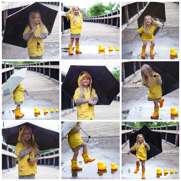 Happy little girl with umbrella and bath ducks standing in rain