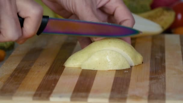 Man Cutting Pear Cutting Board — Stock Video