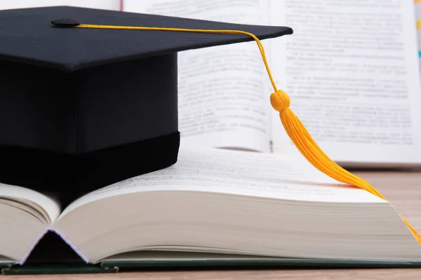 Black Graduated Tassel Cap Placed Book — Stock Photo, Image