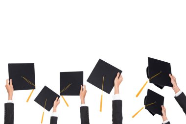 Graduation holds a black hat and a yellow tassel on white isolated background. clipart