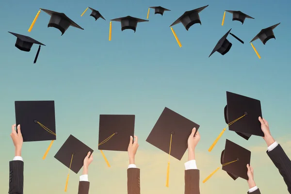 Graduation Holds Black Hat Yellow Tassel Blue Sky Background — Stock Photo, Image