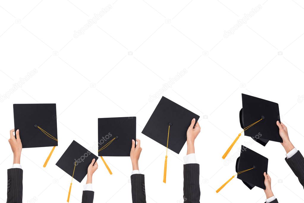 Graduation holds a black hat and a yellow tassel on white isolated background.