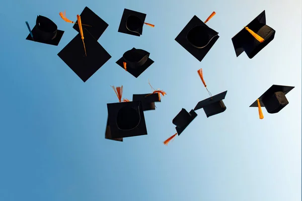 Graduates Throw Black Hats Sky — Stock Photo, Image