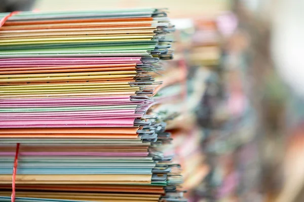 Documents placed on the office desk for recycling.