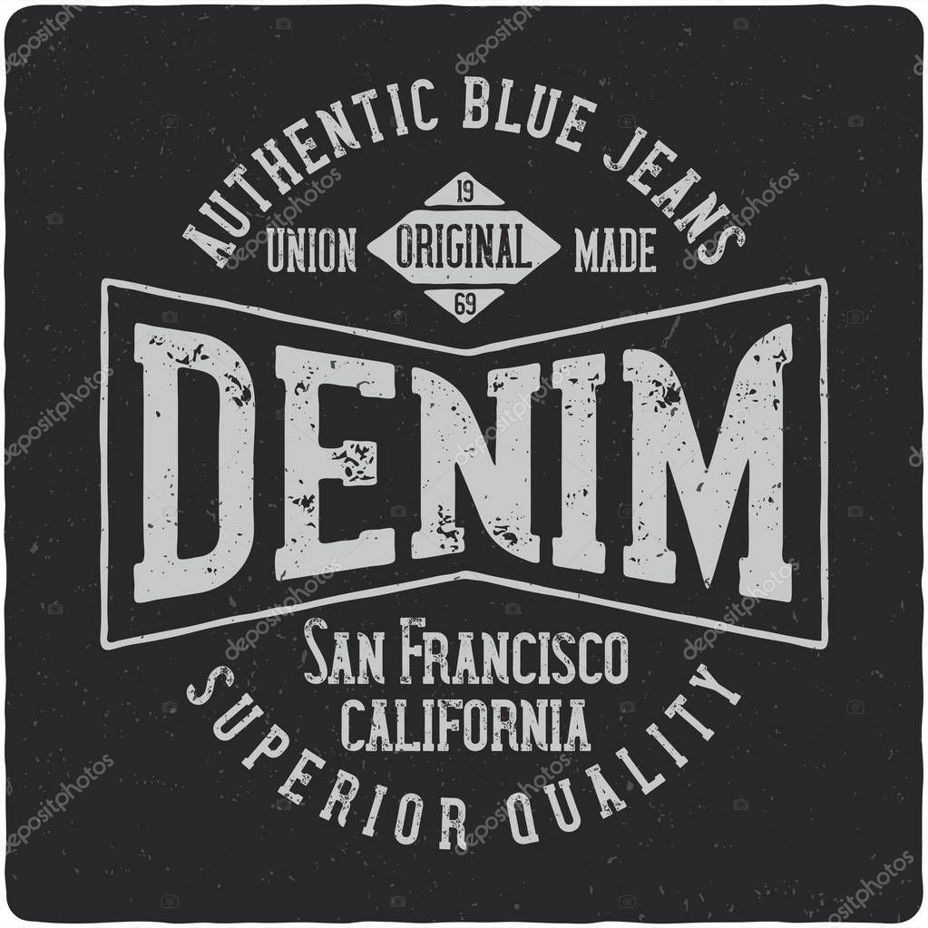 Denim vintage label logo with lettering composition on dark background.