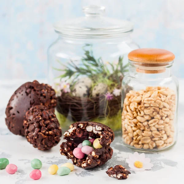 Easter Chocolate and Puffed Wheat Egg with Surprise — Stock Photo, Image