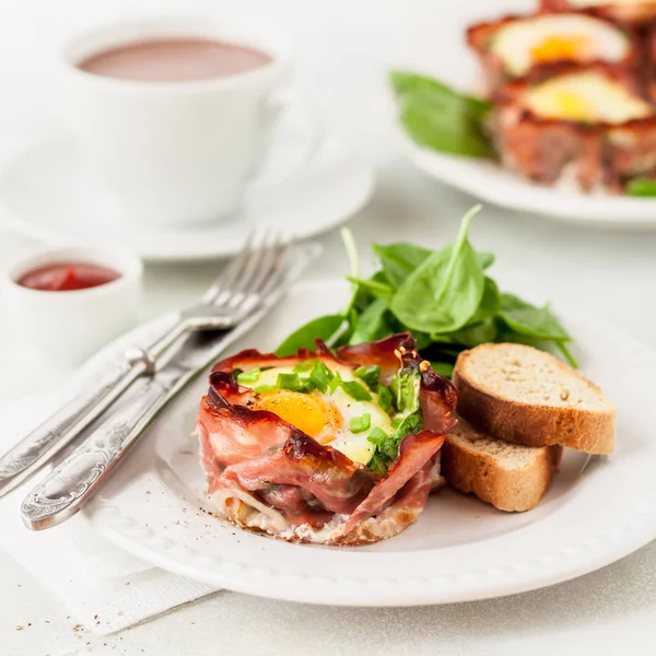 Bacon and Egg Cups with Spinach Stock Photo