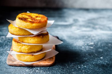 A Stack of Fried Polenta Discs, copy space for your text clipart