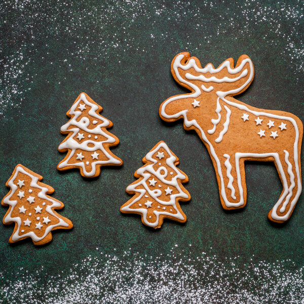 Christmas Gingerbread Cookies over Green Concrete Background, square