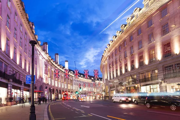2016 June 16 Popular tourist Regent street with flags union jack in night lights — Stock Photo, Image