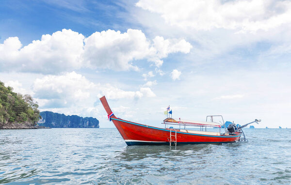 Amzing landscape with traditional longtail boats, rocks, cliffs, beautiful sea tropical and white Ao Nang beach. Popular famous travel vacation  destination Krabi Province, Thailand.
