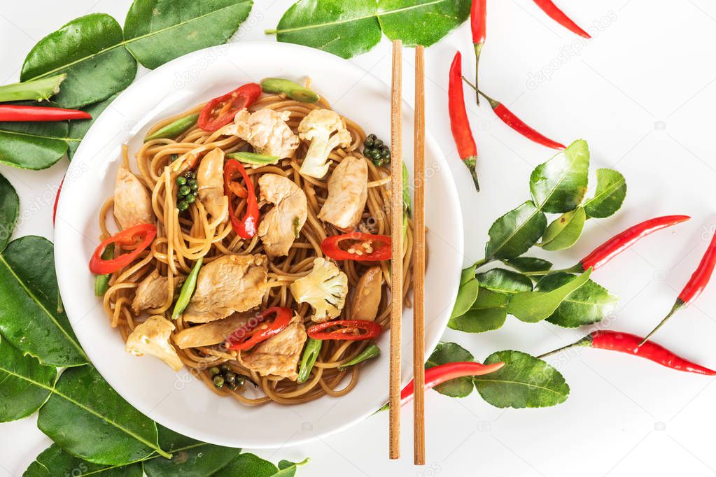 spicy asian wok stir fry spaghetti with chicken and thai spices