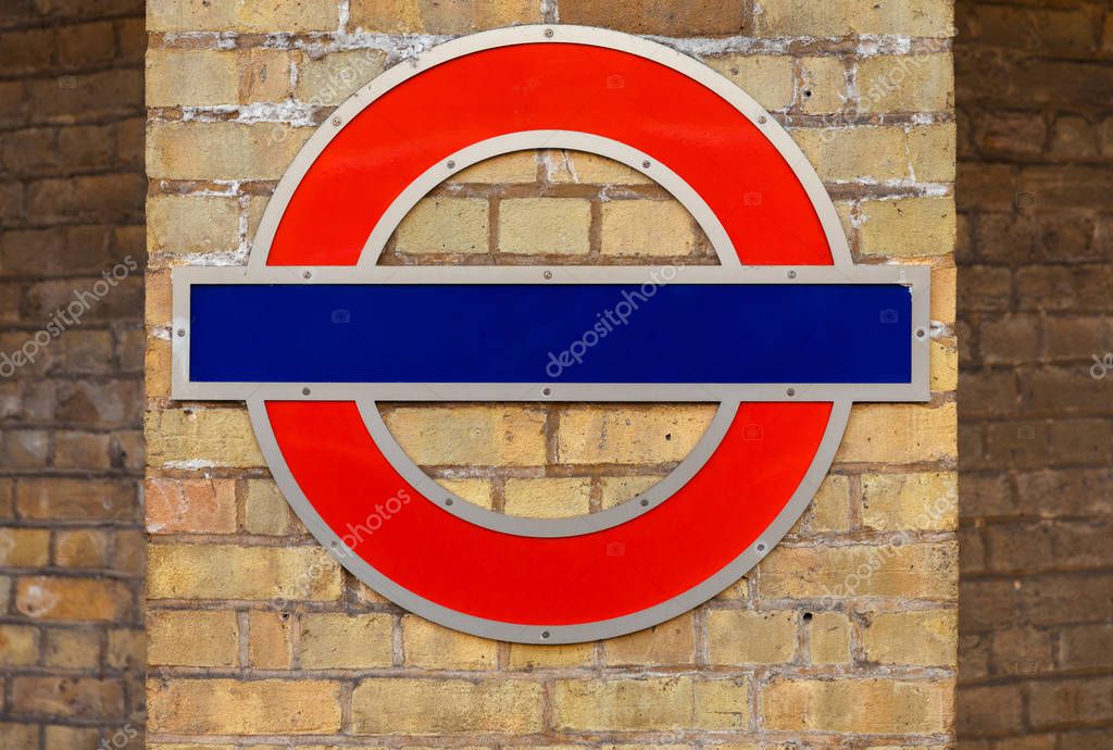 Traditional British underground blank mock up logo empty sign on a brick wall