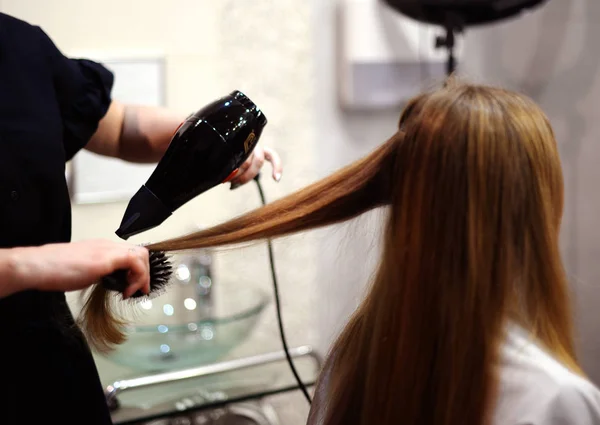 Hair Styling. hairstyle in a beauty salon. hair dryer