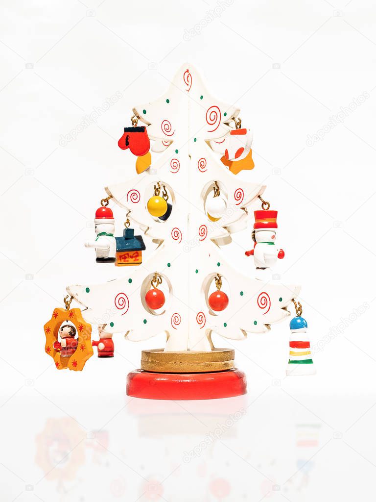 Christmas white ticket decorated with a wooden toy Christmas tree