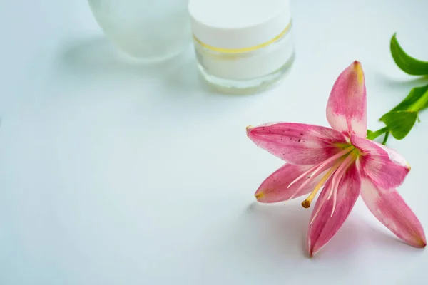 Skin care. Background of flowers and cosmetics.