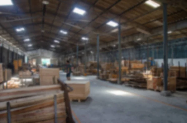 People working in wood factory Furniture, background blur