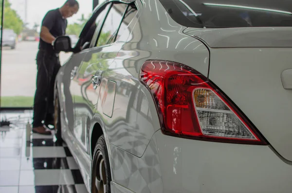 Man working for polishing, coating cars.