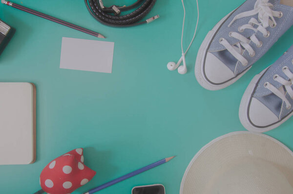 Items of traveler on green background