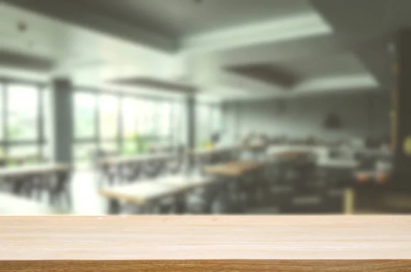 Wood table top and Blur restaurant - vintage effect style picture. Can be used for display or montage your products.