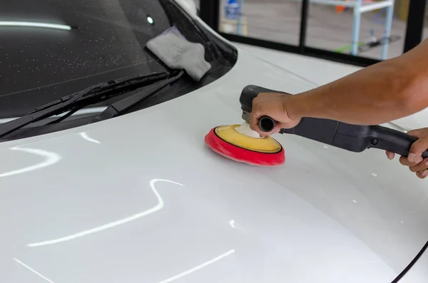 Man working for polishing, coating cars.