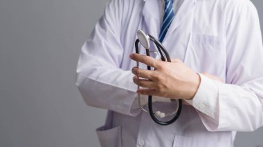 Medical professional in white uniform holding a stethoscope. Perfect for clinic, health service, checkup, doctor consultation, and hospital marketing content.