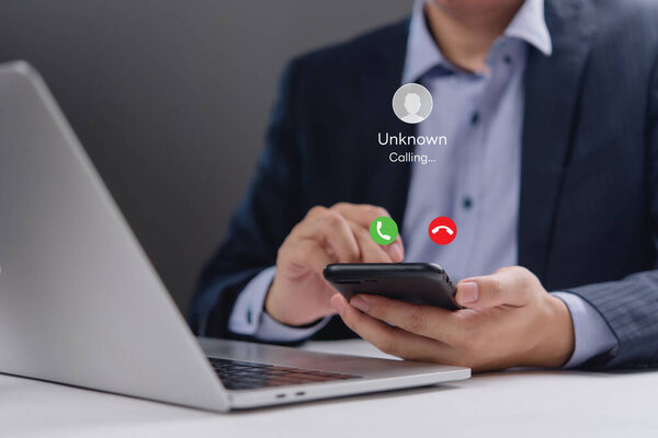 Close-up of a smartphone showing an incoming call from an unknown number. Perfect for office communication, digital communication, and mobile business use visuals.