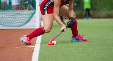 Field Hockey player, ready to pass the ball to a team mate clipart