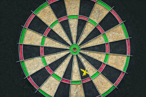 Target dart board on the black background, center point, head to target marketing and business concept