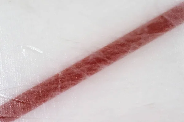 Ice hockey rink red markings closeup, winter sport background