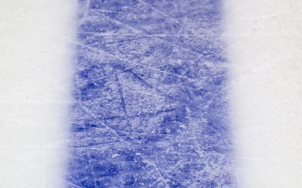 ice background with marks from skating and hockey, blue texture