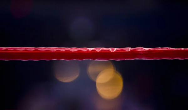 Boxing ring ropes with a blur spotlight