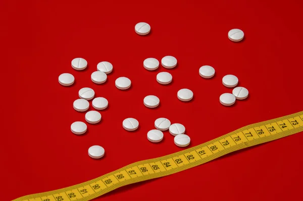 Diet concept. Slimming with pills, abletes, dangerous for health. anorexia, bulimia - dangerous. — Stock Image Diet Concept Slimming Pills Abletes Dangerous Health Anorexia Bulimia Dangerous Royalty Free Stock Images