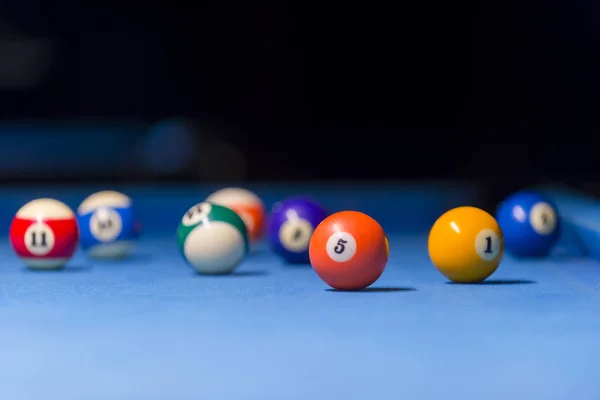 Billiard balls on pool blue table - sport background