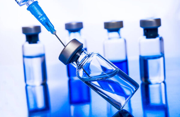 Medical concept Vaccination vaccine vial dose flu shot drug needle syringe