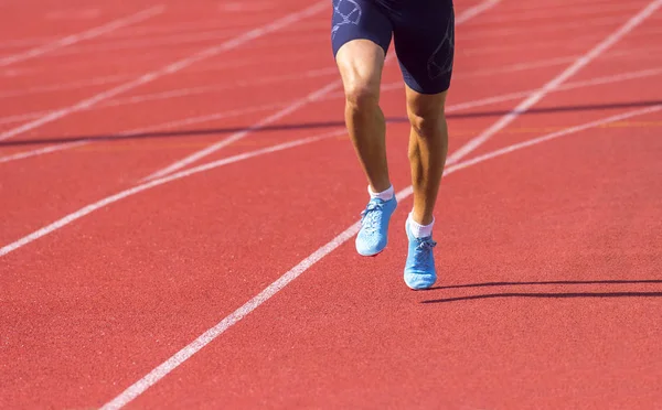 Young sporty man running on sunny day — Stock Photo, Image