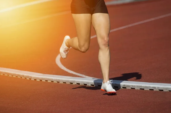 Athletics woman running on the track field — Stock Photo, Image