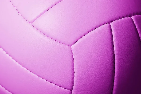 Closeup detail of volleyball ball texture background. Pink filter
