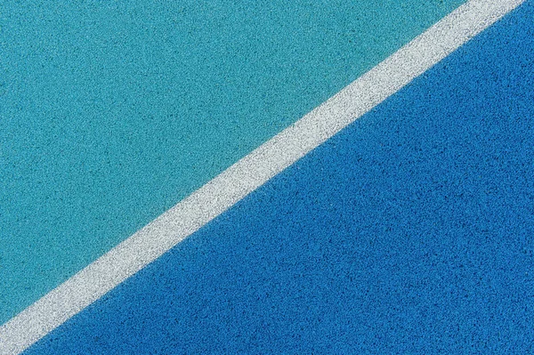 Colorato campo sportivo sfondo. Vista dall'alto campo blu gomma gro — Foto Stock