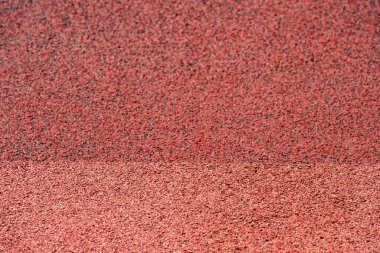 Arka plan için kauçuk kaplama dokusu çalıştırılıyor. Spor arka plan gözlemi