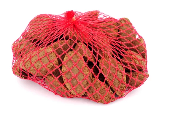 Brazil nuts in red string bag packaging