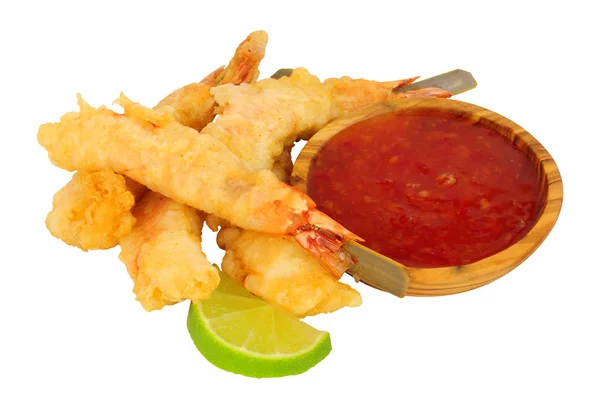Tempura battered king tiger prawns on wooden skewers with chilli sauce dip isolated on a white background