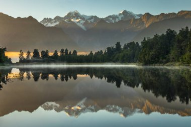 Lake Matheson. Locate near the Fox Glacier in West Coast of South Island of New Zealand. It is famous for its reflected views of Aoraki/Mount Cook and Mount Tasman. clipart