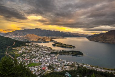 Cityscape of Queenstown and Lake Wakaitipu with The Remarkables in the background from viewpoint at Queenstown Skyline, New Zealand clipart